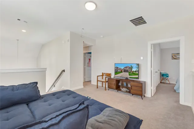 a living room with furniture and a couch