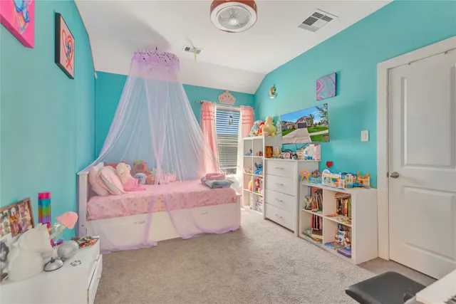 a bedroom with furniture and a bed