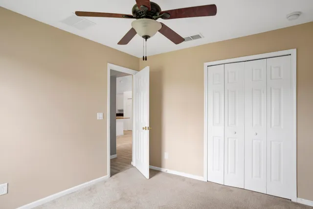 a bathroom with a sink vanity mirror and toilet