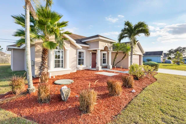 a front view of a house with swimming pool