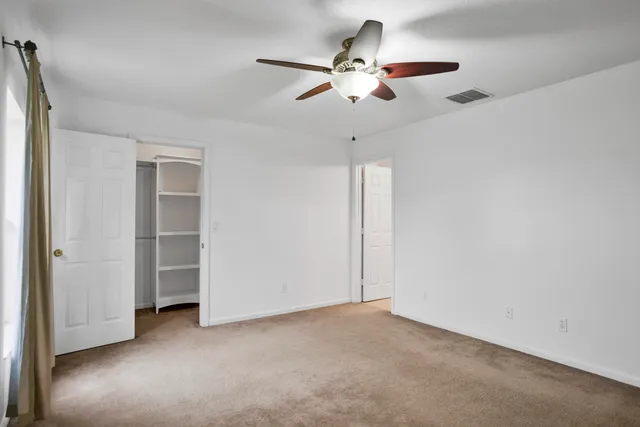 a bathroom with a granite countertop sink mirror and a bathtub