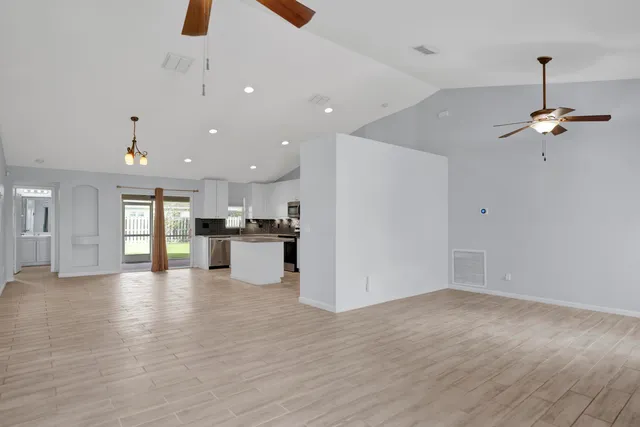 a view of a kitchen with a sink and a window