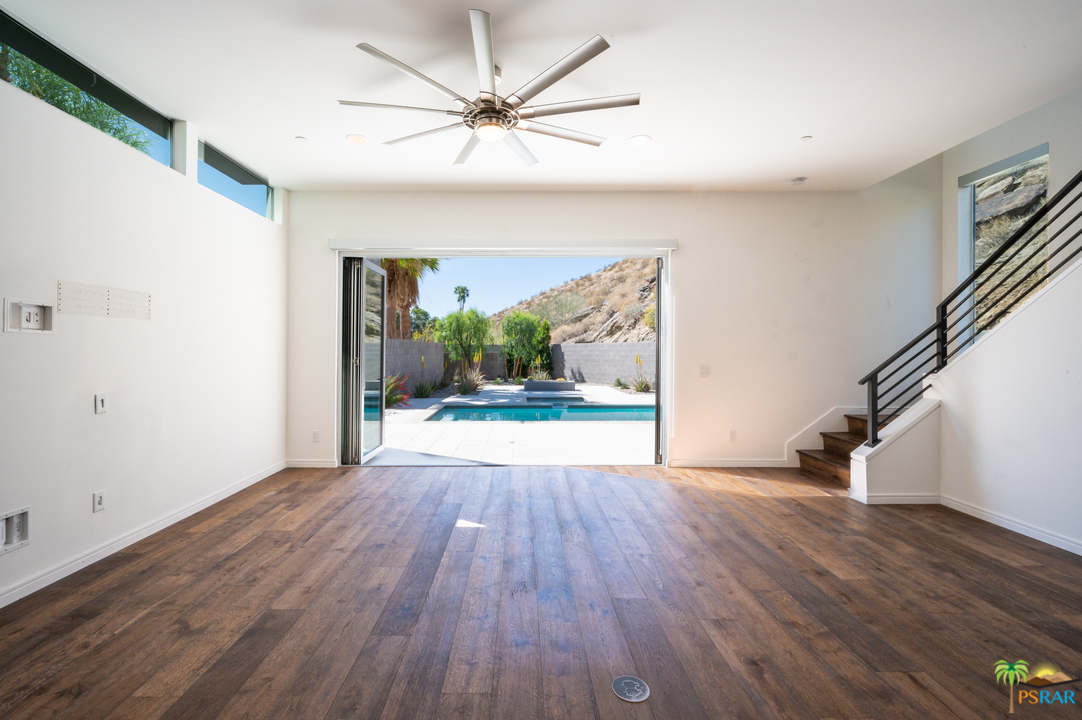 1521 South Belardo Road Palm Springs, CA 92264 - Photo 15 of 37 wooden floor in an empty room with a window