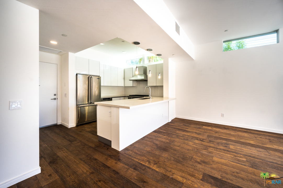 1521 South Belardo Road Palm Springs, CA 92264 - Photo 17 of 37 a kitchen with a refrigerator and microwave