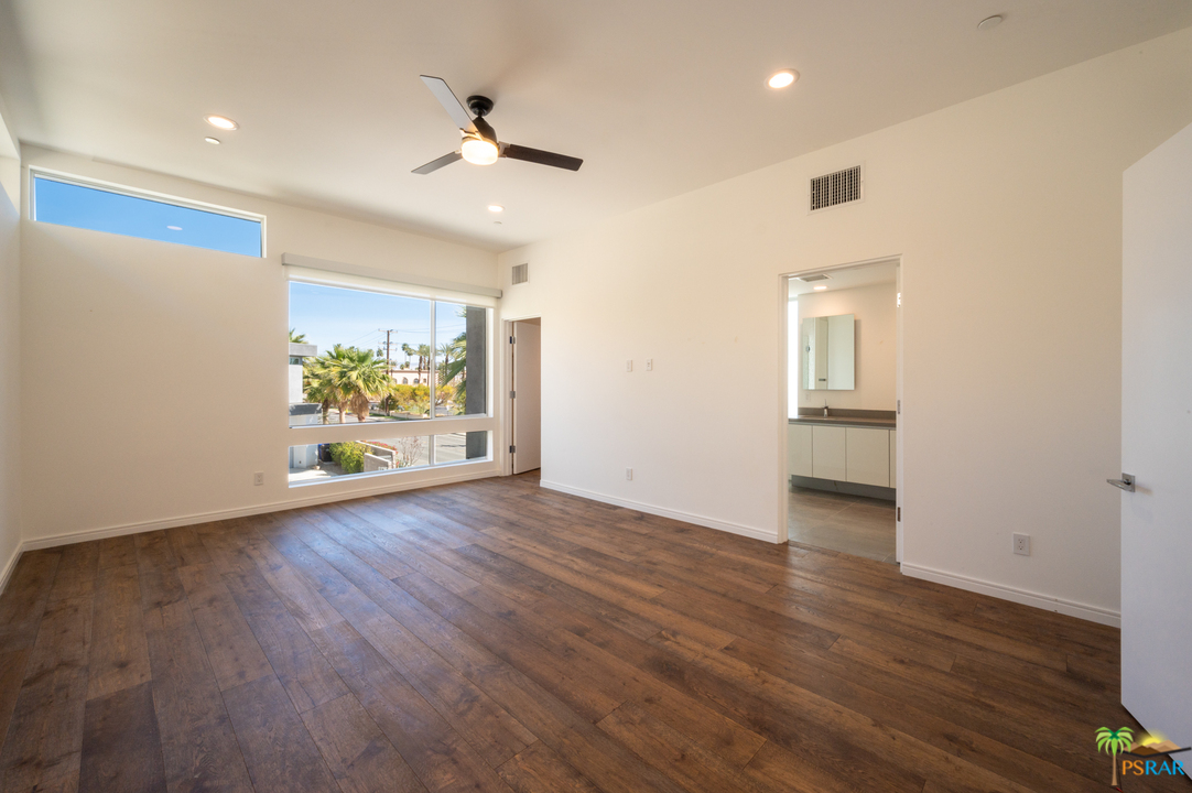 1521 South Belardo Road Palm Springs, CA 92264 - Photo 24 of 37 a view of an empty room with wooden floor and a window