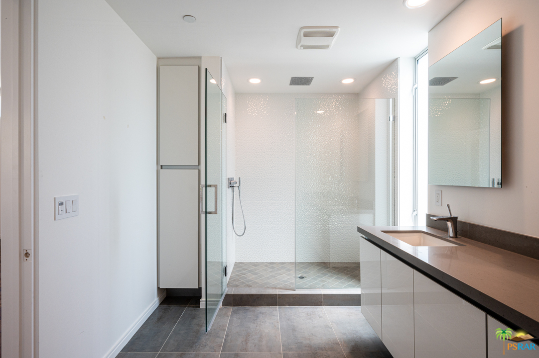 1521 South Belardo Road Palm Springs, CA 92264 - Photo 27 of 37 a bathroom with a sink and a mirror