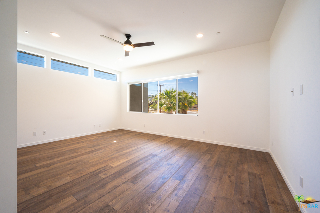 1521 South Belardo Road Palm Springs, CA 92264 - Photo 29 of 37 wooden floor in an empty room with a window