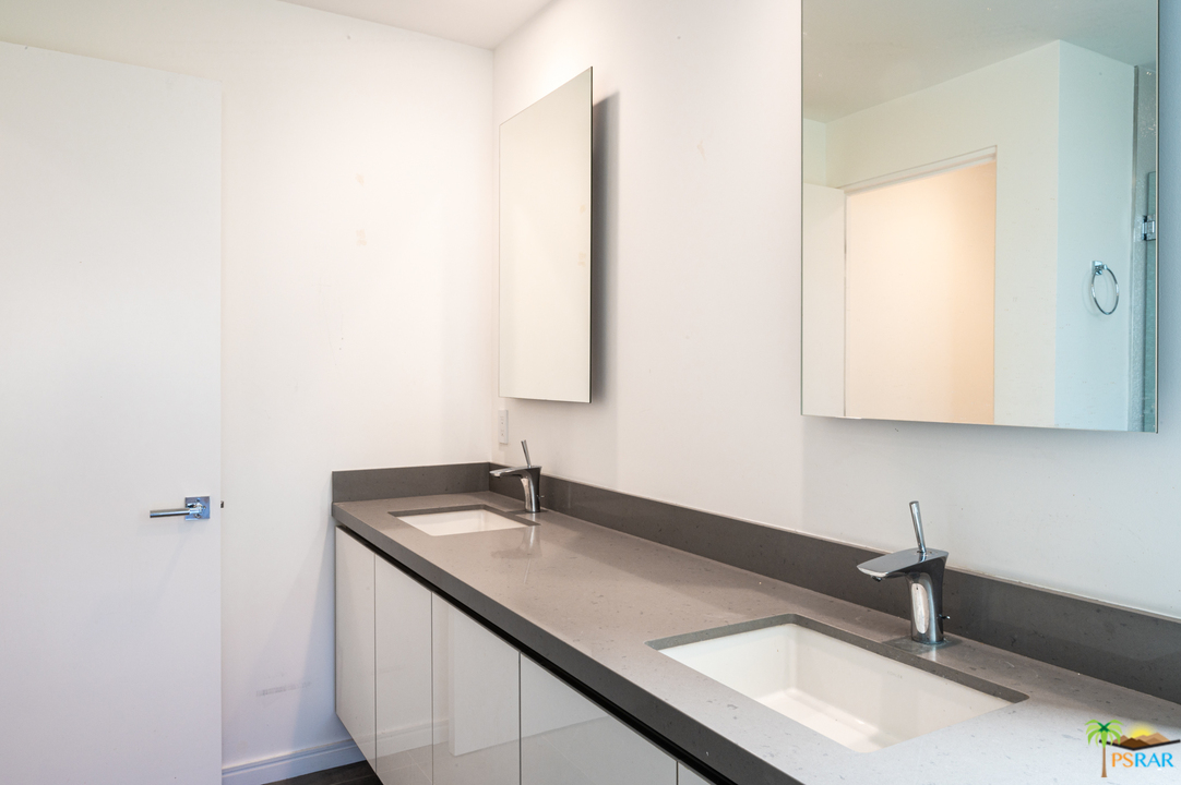 1521 South Belardo Road Palm Springs, CA 92264 - Photo 35 of 37 a bathroom with a sink and a mirror