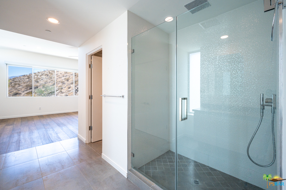1521 South Belardo Road Palm Springs, CA 92264 - Photo 36 of 37 a bathroom with a glass shower door