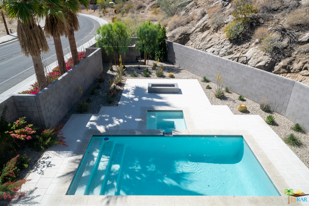 1521 South Belardo Road Palm Springs, CA 92264 - Photo 7 of 37 a view of a swimming pool with sitting area