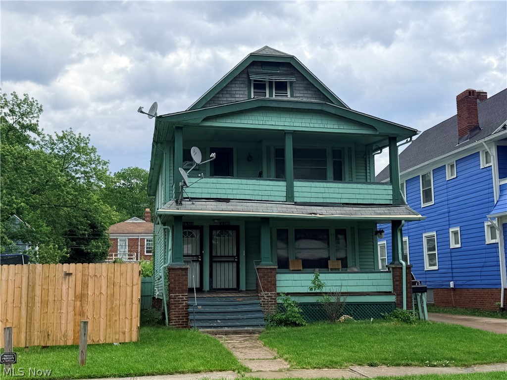 16308 Nela View Road Cleveland, OH 44112 - Photo 13 of 13 Multi-story residence featuring a covered front porch and an upper-level balcony