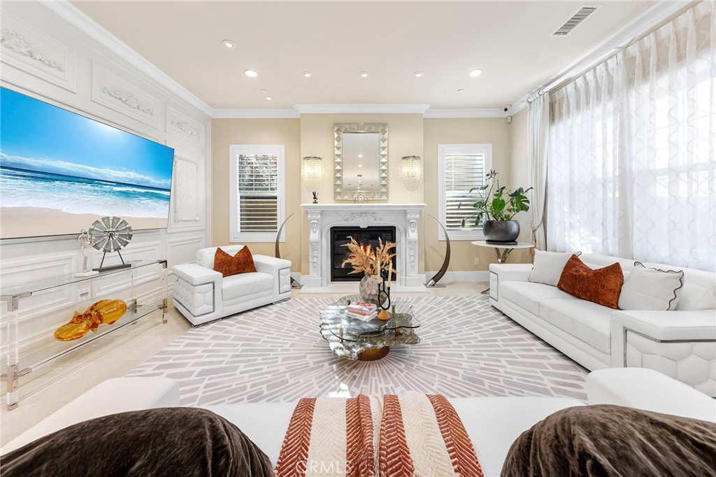 123 Calderon Irvine, CA 92618 - Photo 13 of 74 a living room with furniture fireplace and a large window