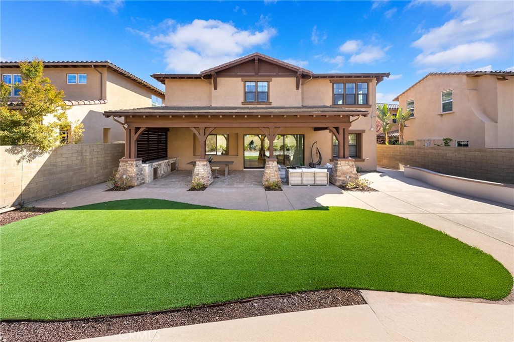 123 Calderon Irvine, CA 92618 - Photo 55 of 74 a front view of a house with garden