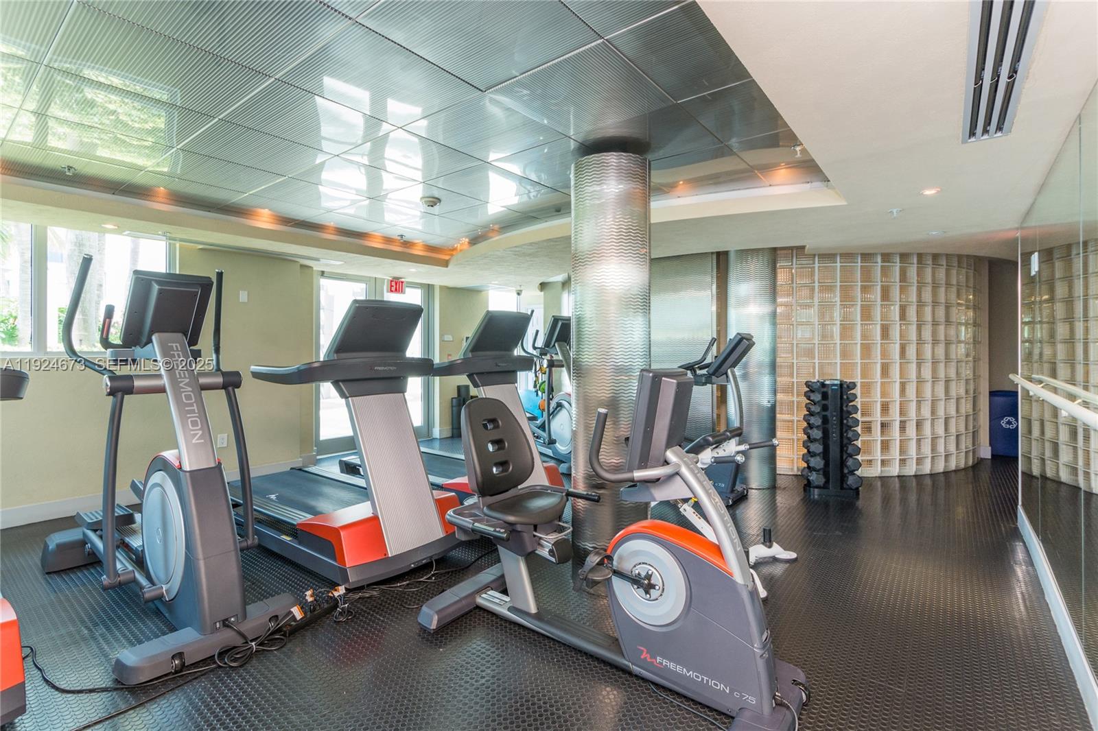 110 Washington Avenue, Unit 1822 Miami Beach, FL 33139 - Photo 15 of 17 a view of a room with gym equipment