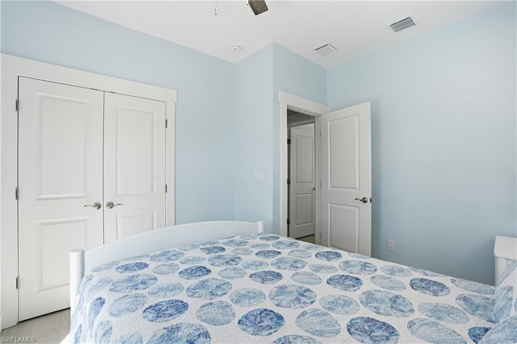 1 Fairview Boulevard Fort Myers Beach, FL 33931 - Photo 21 of 48 a bedroom with a bed and a window