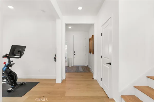 a bathroom with a granite countertop tub shower and mirror