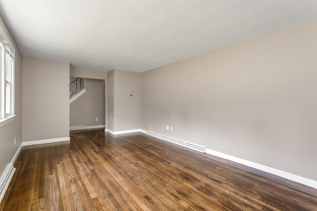 12 Sargent Lane Franklin, MA 02038 - Photo 11 of 40 a view of an empty room and wooden floor