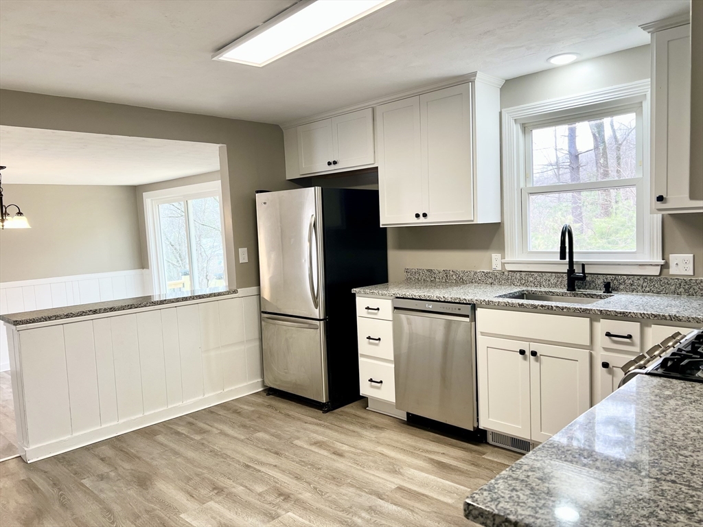 12 Sargent Lane Franklin, MA 02038 - Photo 14 of 40 a kitchen with a refrigerator stove and sink
