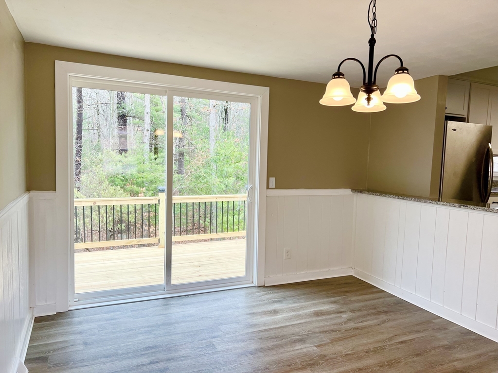 12 Sargent Lane Franklin, MA 02038 - Photo 20 of 40 a view of a room with wooden floor and iron gate