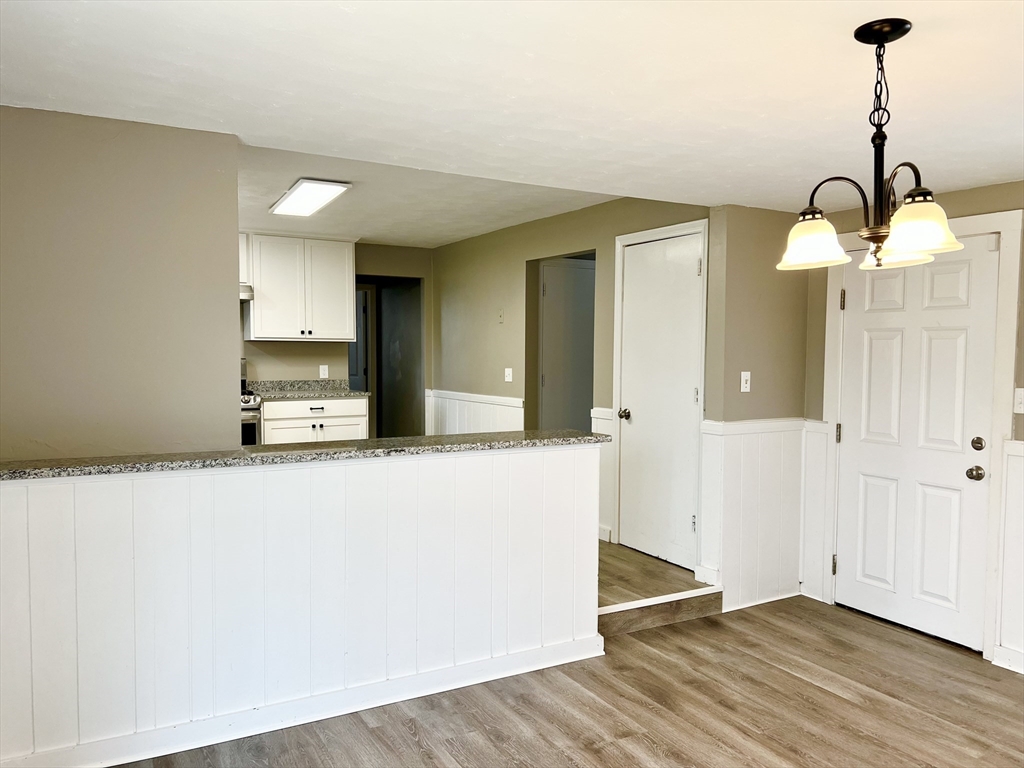 12 Sargent Lane Franklin, MA 02038 - Photo 21 of 40 a view of a kitchen cabinets and wooden floor
