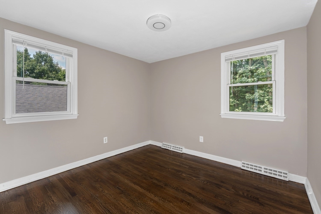 12 Sargent Lane Franklin, MA 02038 - Photo 31 of 40 a view of a room that has wooden floor and windows
