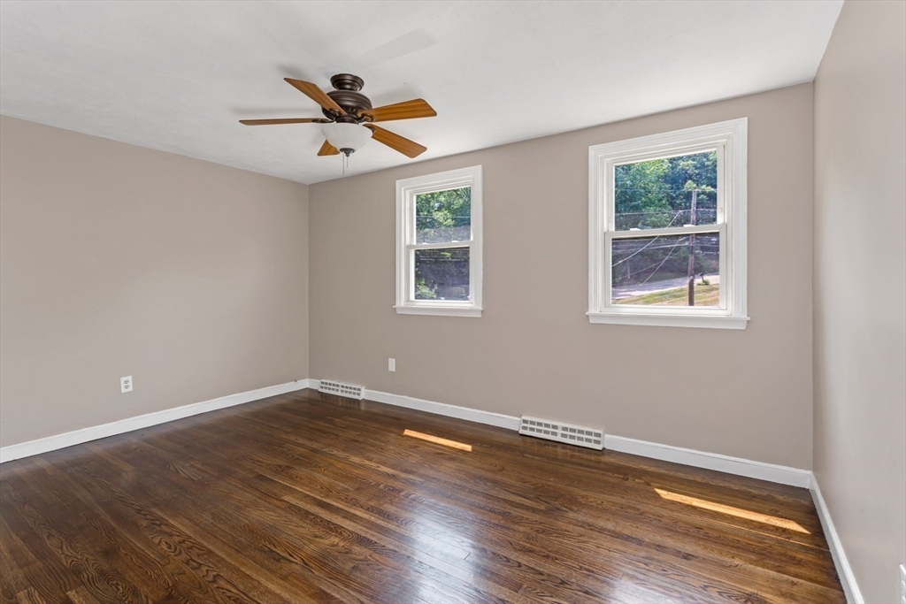 12 Sargent Lane Franklin, MA 02038 - Photo 33 of 40 a view of empty room with wooden floor and fan