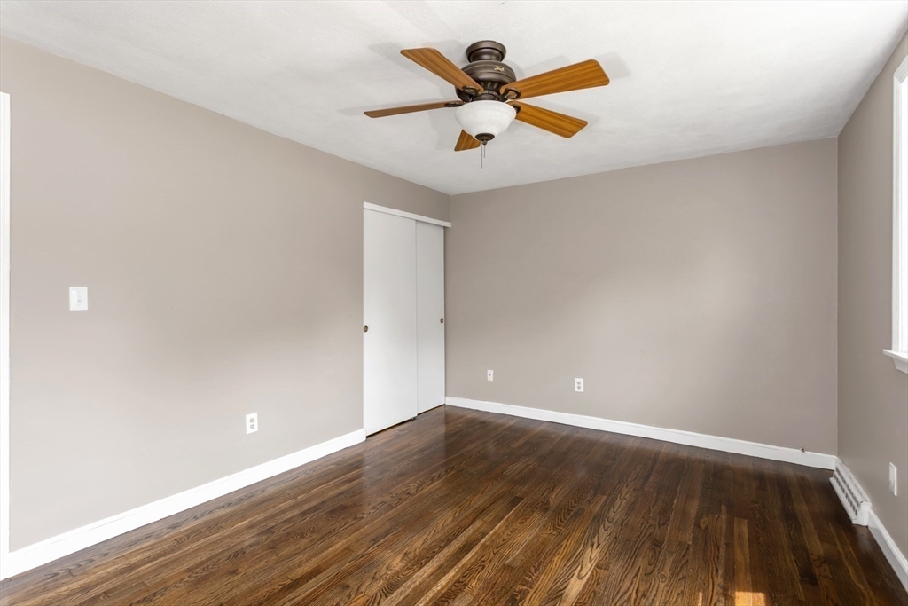 12 Sargent Lane Franklin, MA 02038 - Photo 34 of 40 a view of room with wooden floor and ceiling fan