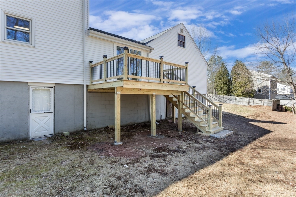 12 Sargent Lane Franklin, MA 02038 - Photo 39 of 40 a view of a house with backyard porch and furniture