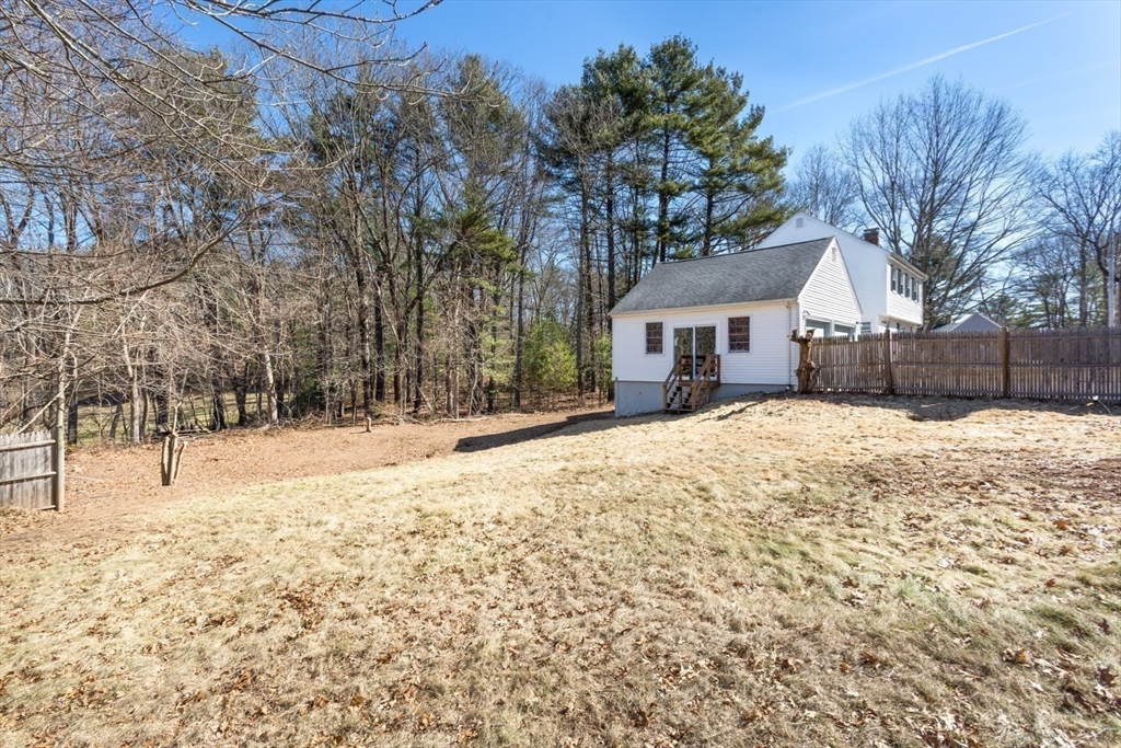 12 Sargent Lane Franklin, MA 02038 - Photo 40 of 40 a pathway of a house with a yard covered in snow