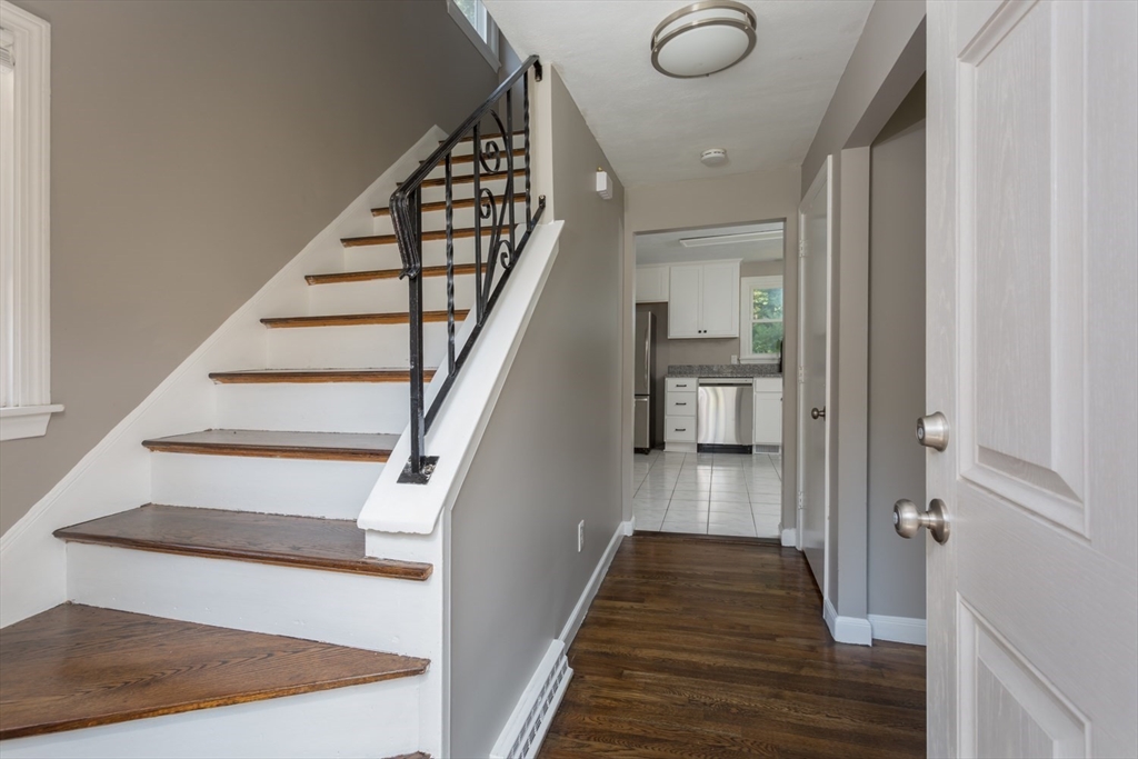 12 Sargent Lane Franklin, MA 02038 - Photo 6 of 40 a view of entryway and hall with wooden floor