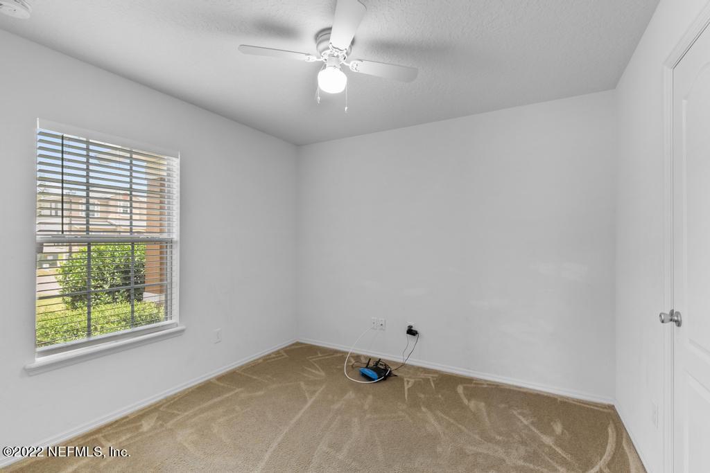 2527 Eisner Drive Jacksonville, FL 32218 - Photo 17 of 29 a view of a room with window and ceiling fan