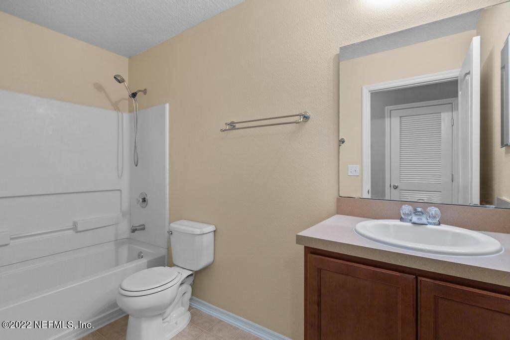 2527 Eisner Drive Jacksonville, FL 32218 - Photo 18 of 29 a bathroom with a sink a toilet and shower