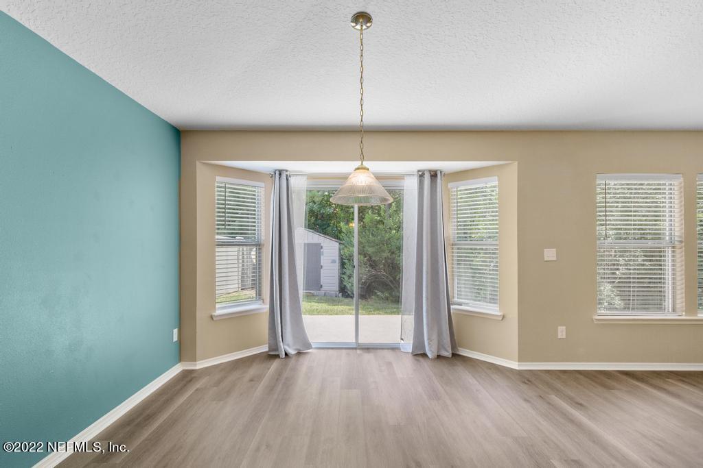2527 Eisner Drive Jacksonville, FL 32218 - Photo 8 of 29 a view of an empty room with glass door and balcony