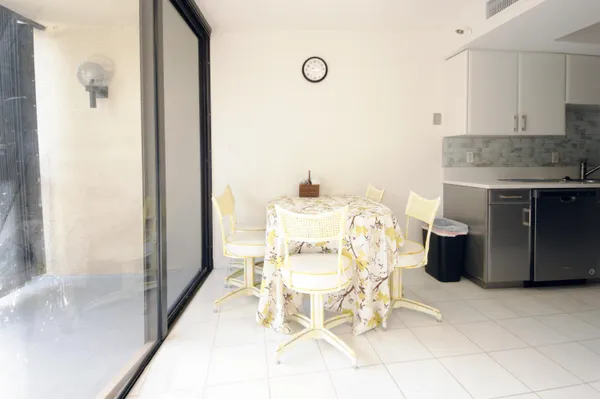 a kitchen with a sink and refrigerator