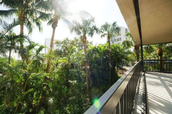 a bathroom with a glass shower door and a sink