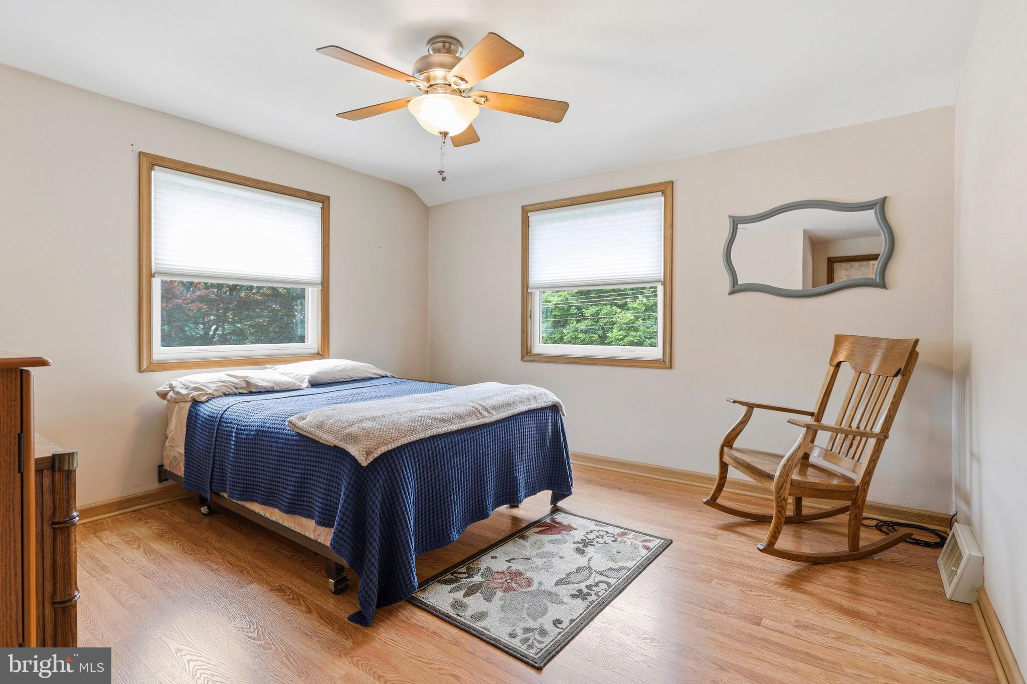 527 Saxer Avenue Springfield, PA 19064 - Photo 22 of 33 a bed sitting in a bedroom next to a window