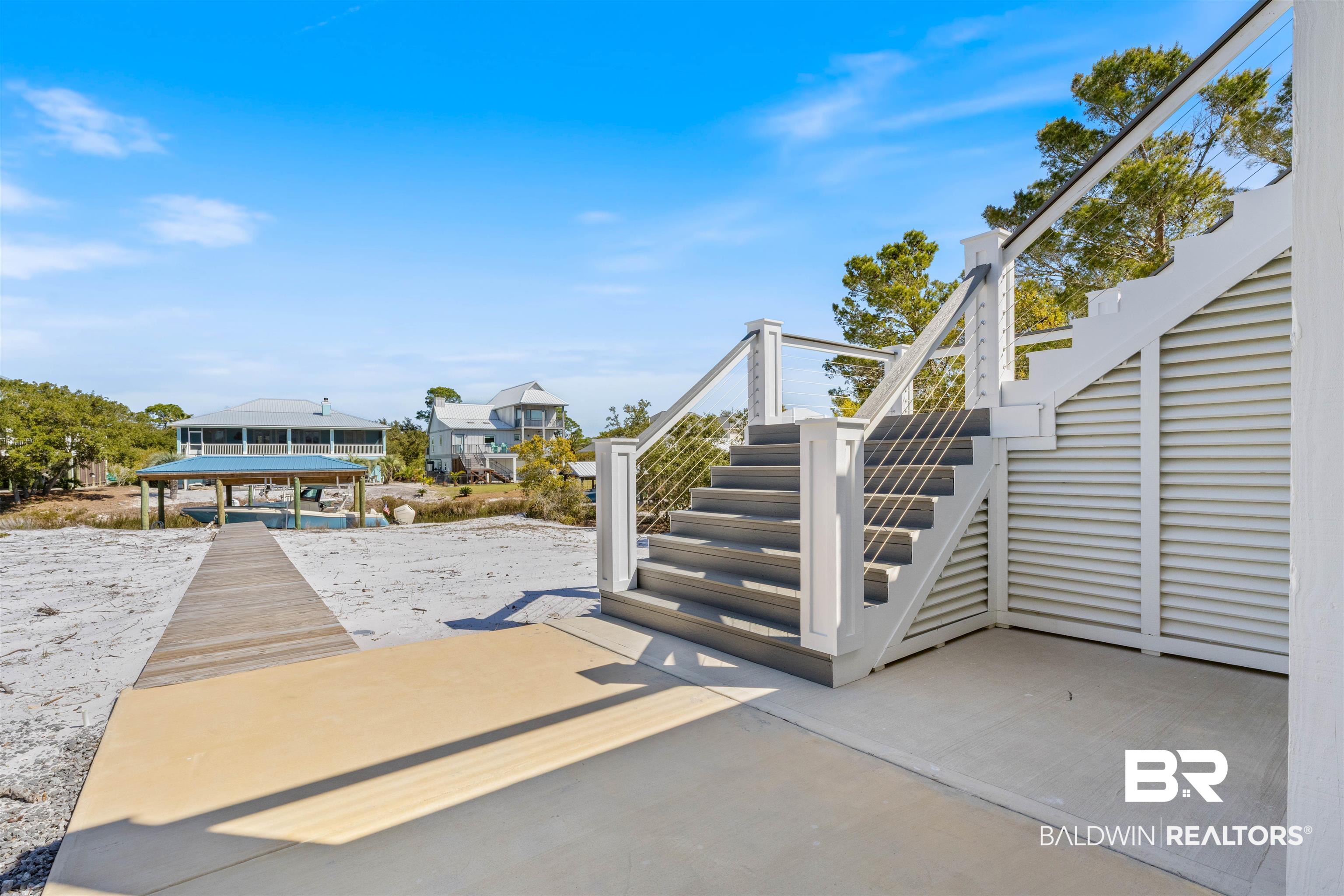 32315 River Road Orange Beach, AL 36561 - Photo 14 of 68 View of patio featuring stairs