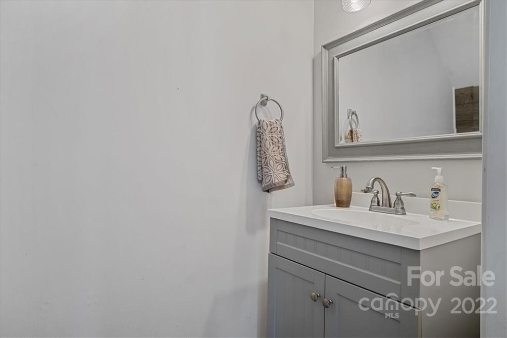 244 Sand Paver Way, Unit 60 Fort Mill, SC 29708 - Photo 20 of 42 a bathroom with a sink vanity and a mirror
