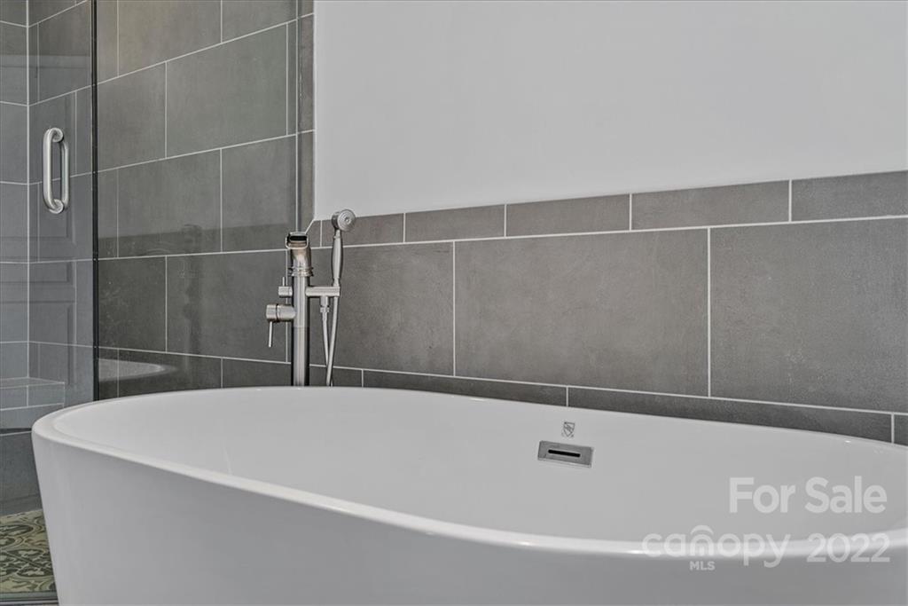 244 Sand Paver Way, Unit 60 Fort Mill, SC 29708 - Photo 28 of 42 a bathroom with a bathtub