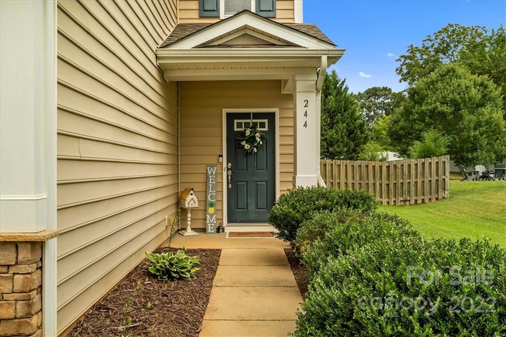 244 Sand Paver Way, Unit 60 Fort Mill, SC 29708 - Photo 3 of 42 a front view of a house with garden