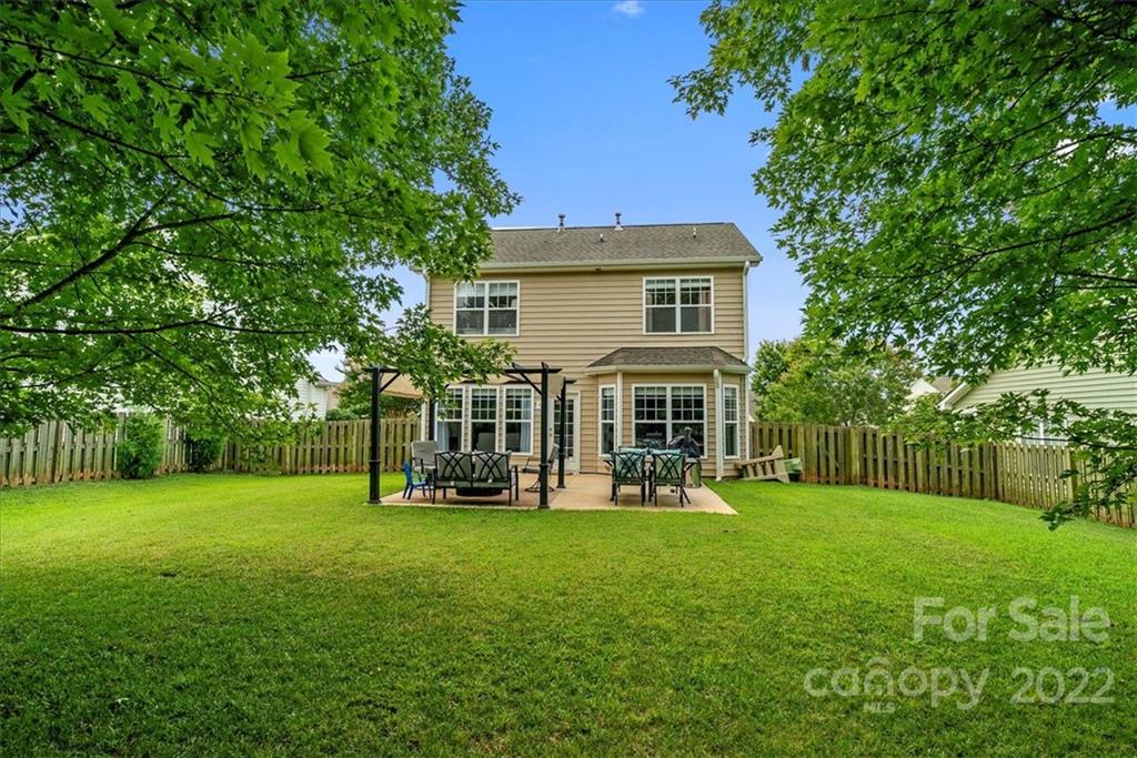 244 Sand Paver Way, Unit 60 Fort Mill, SC 29708 - Photo 39 of 42 a view of a house with a big yard and large trees