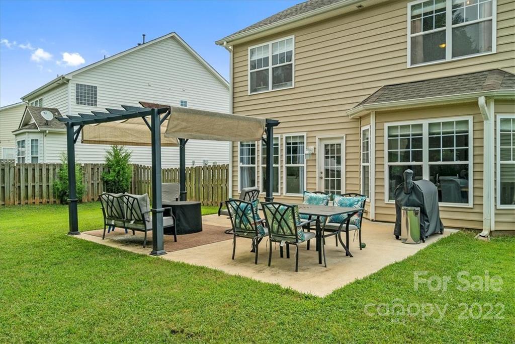 244 Sand Paver Way, Unit 60 Fort Mill, SC 29708 - Photo 40 of 42 a view of a house with backyard and sitting area