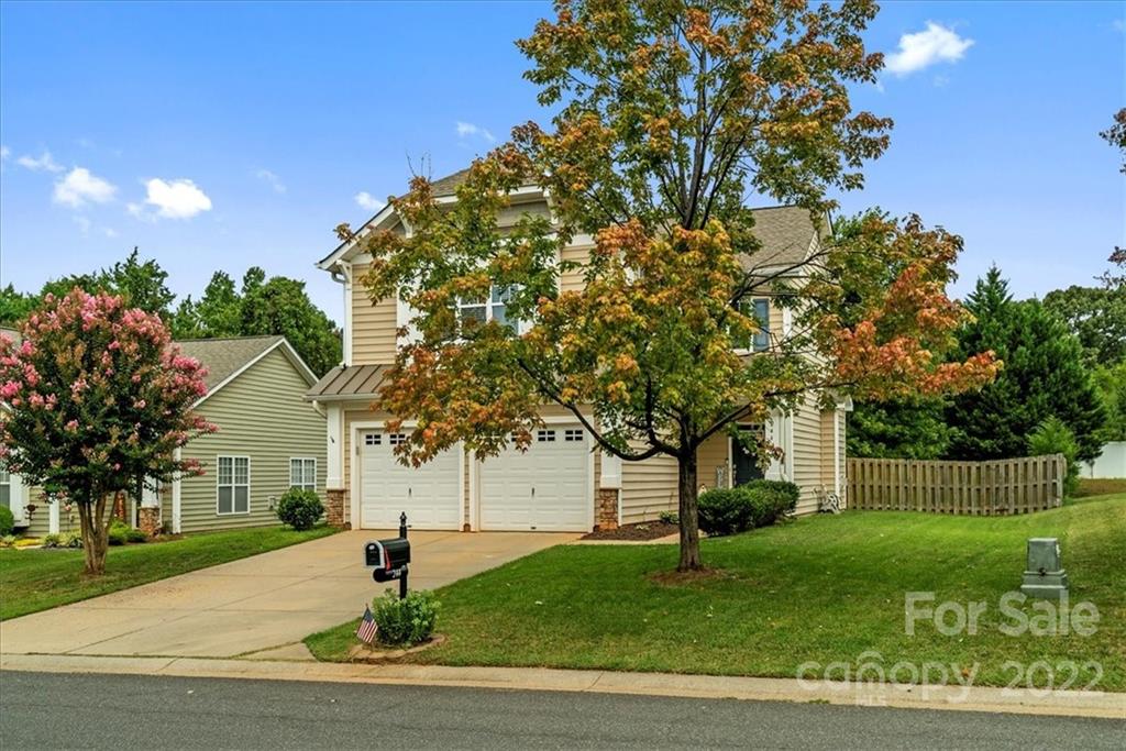 244 Sand Paver Way, Unit 60 Fort Mill, SC 29708 - Photo 42 of 42 a front view of a house with a yard