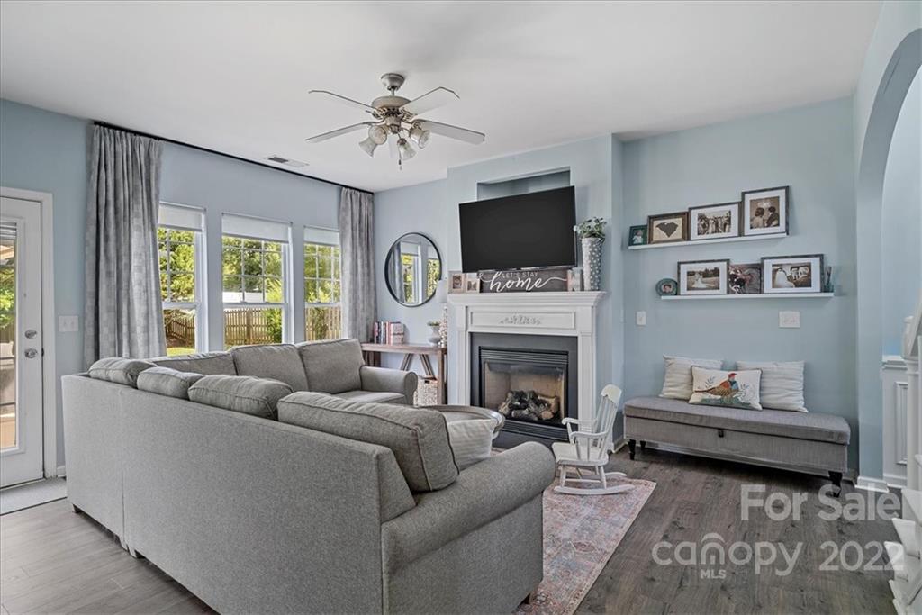 244 Sand Paver Way, Unit 60 Fort Mill, SC 29708 - Photo 9 of 42 a living room with furniture and a fireplace