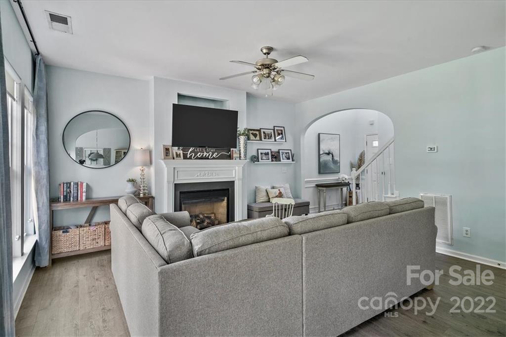244 Sand Paver Way, Unit 60 Fort Mill, SC 29708 - Photo 10 of 42 a living room with furniture a fireplace and a flat screen tv