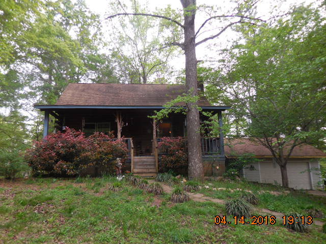 4061 Johnstonville Road Forsyth, GA 31029 - Photo 2 of 8 a front view of a house with garden