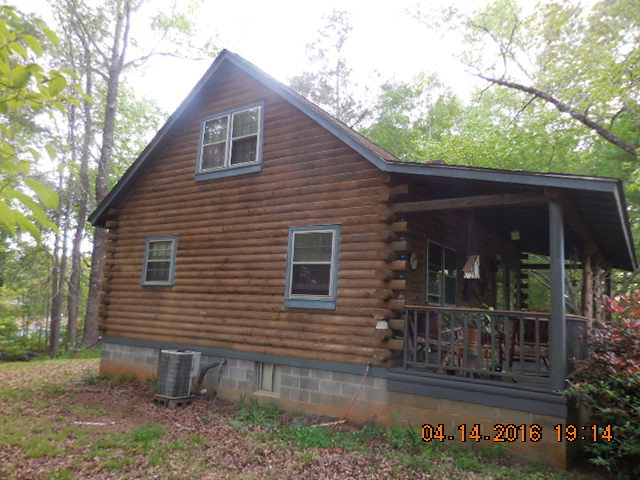 4061 Johnstonville Road Forsyth, GA 31029 - Photo 7 of 8 a view of a house with a yard