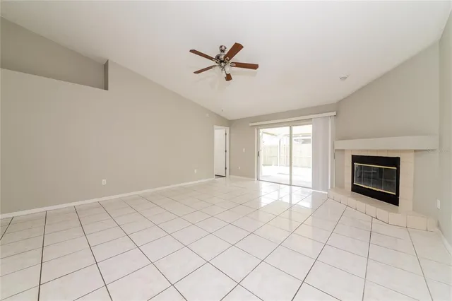 a view of an empty room with a fireplace