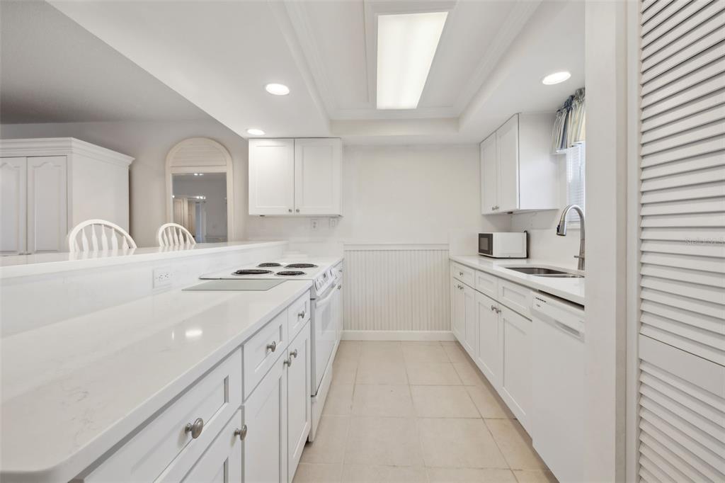 125 River Bend Road, Unit D Welaka, FL 32193 - Photo 11 of 53 a kitchen with sink stove and cabinets