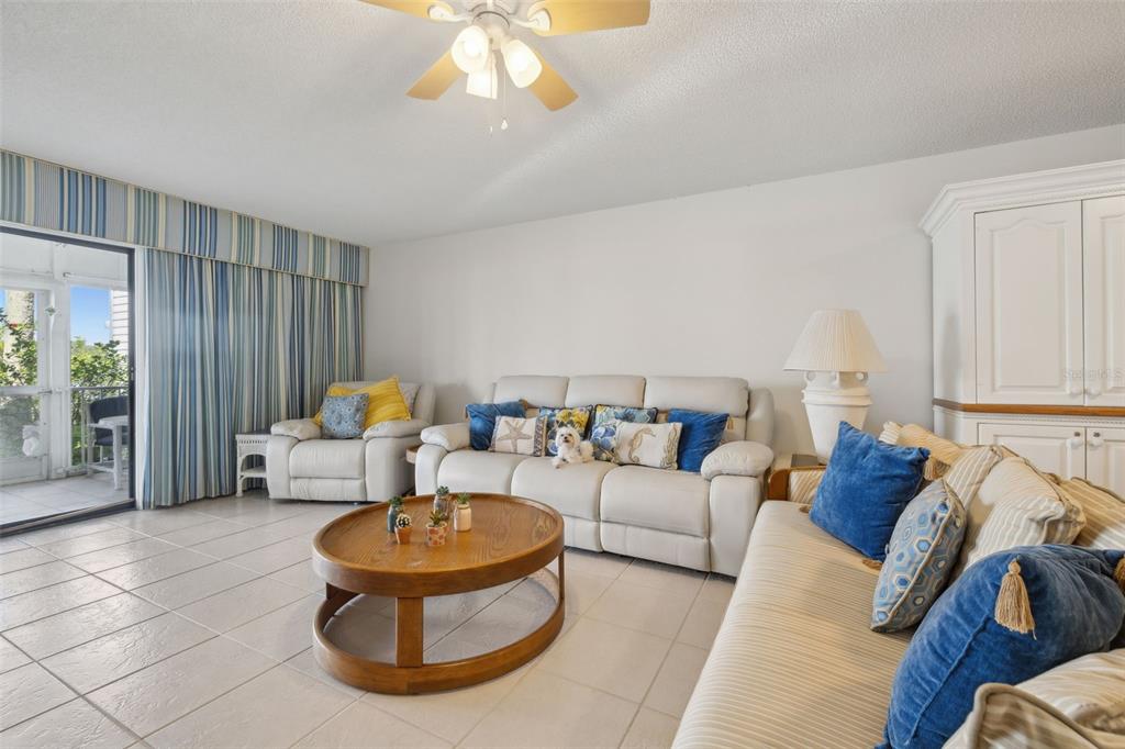 125 River Bend Road, Unit D Welaka, FL 32193 - Photo 18 of 53 a living room with furniture and a large window